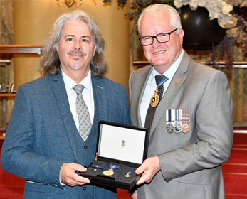 Paul Tunzi AM receives his Order of Australia from the Governor-of Western Australia, His Excellency the Honourable Chris Dawson AC APM